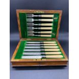 A Boxed Set of Silver and Bone Handled knives and forks, six place setting.