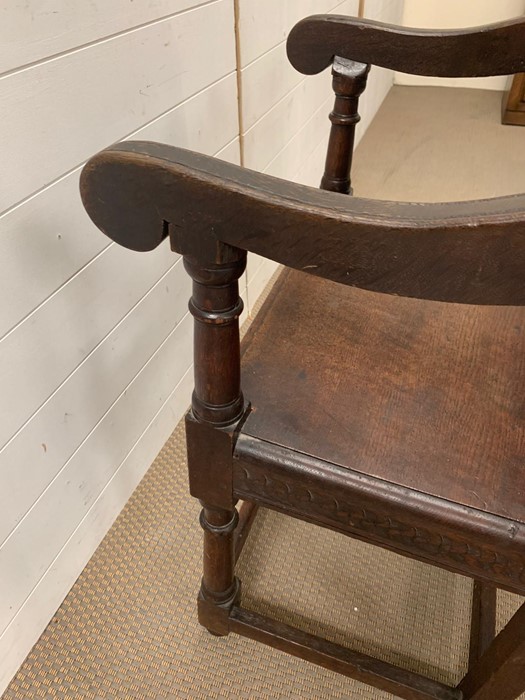 A Wainscot chair oak panel open arm chair with scrolled arms, plank seat raised on turned legs. - Image 7 of 7