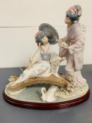 A large Lladro figure of two geishas on bridge 1445