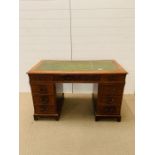 Pedestal desk with green leather top