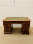 Pedestal desk with green leather top
