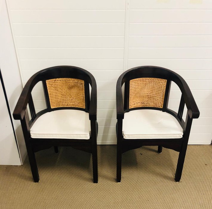 A Pair of Cane Backed Chairs