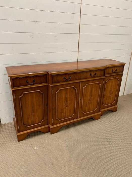 A Yew wood sideboard with double doors to centre flanked by single cupboards and three drawers H87cm - Image 2 of 4