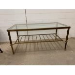 A Brass and Glass Table in the style of Maison Johnson.