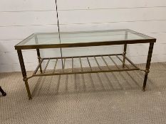 A Brass and Glass Table in the style of Maison Johnson.