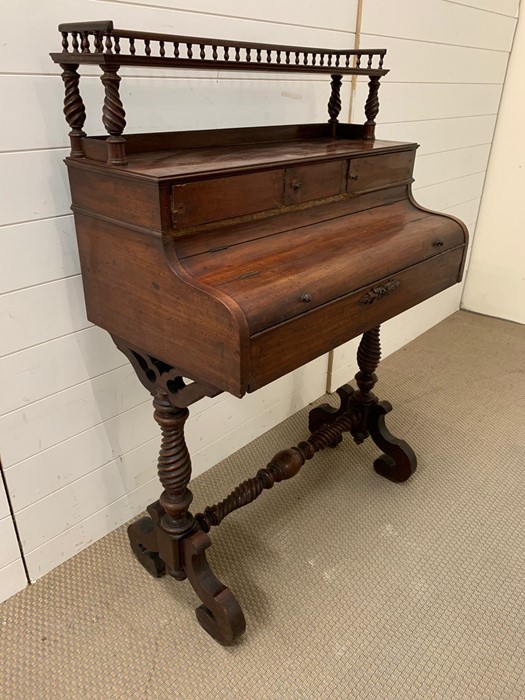 A mahogany writing table with an arrangement of drawers on scroll legs - Image 3 of 4