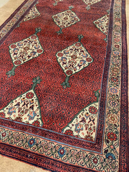 Large Persian style carpet of overall repeated floral design AF (344cm x 188cm) - Image 4 of 6