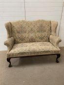 Wingback sofa on ball and claw feet (H112cm W144cm D74cm)