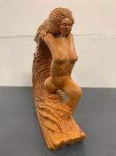 A Wood Carved Figure of a Woman by Ron Barr