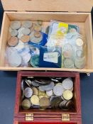 A Variety of Various coins in two boxes.