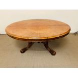 Burr walnut oval breakfast table on baluster column tripod legs terminating in scrolled feet