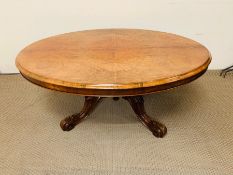 Burr walnut oval breakfast table on baluster column tripod legs terminating in scrolled feet