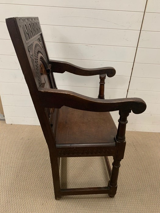 A Wainscot chair oak panel open arm chair with scrolled arms, plank seat raised on turned legs. - Image 3 of 7