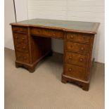 Figured walnut pedestal desk with an arrangement of nine drawers (H76cm W122cm D70cm)