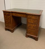 Figured walnut pedestal desk with an arrangement of nine drawers (H76cm W122cm D70cm)