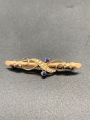 A 9 ct yellow gold sapphire and seed pearl brooch