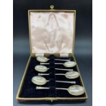 A Boxed set of six silver coffee spoons, makers mark F & W. Sheffield 1947.