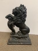 A Cast Iron Lion Door Stop