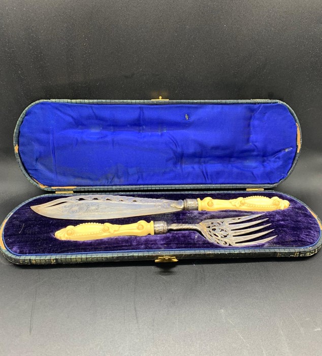 A cased set of bone handled or silver fish servers, Makers Mark JR, hallmarked Sheffield 1865.