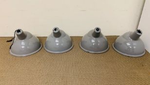 Four grey enameled steel industrial light pendants