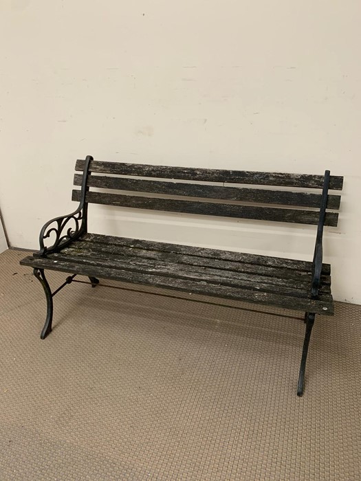 Garden wooden slatted bench with cast iron arms (H67cm W123cm D46cm)