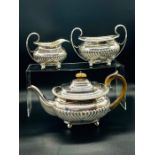 A Three piece silver tea set with Teapot, milk jug and sugar bowl, hallmarked London 1896, makers