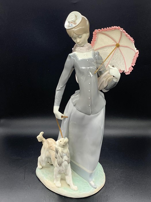 Lladro figure of a lady walking her Afghan dog