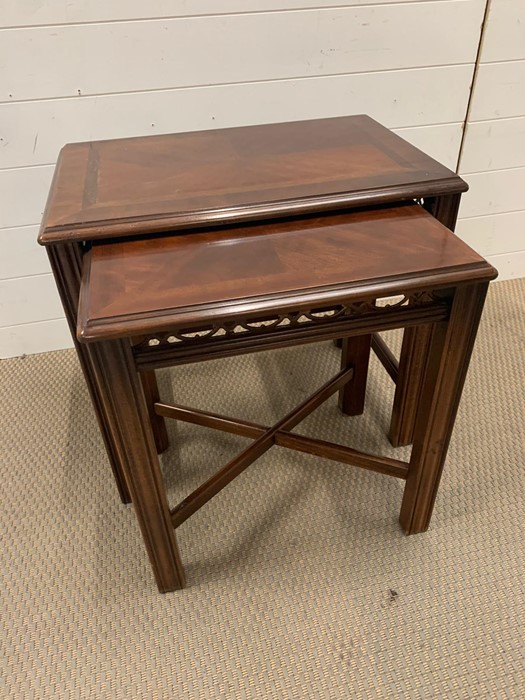 Nest of mahogany tables with pieced backs