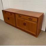 A pair of mid century G-Plan teak cabinets (H69cm W84cm D46cm)