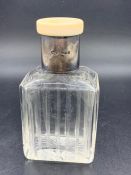 A Gents Dressing Table Bottle with hallmarked silver collar and ivory top
