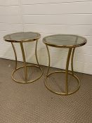 Pair of round gold metal framed side tables with smoked glass