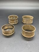 A Selection of Four Silver, various hallmarks, napkin rings.
