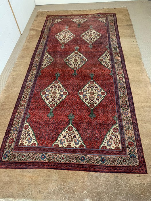 Large Persian style carpet of overall repeated floral design AF (344cm x 188cm) - Image 5 of 6