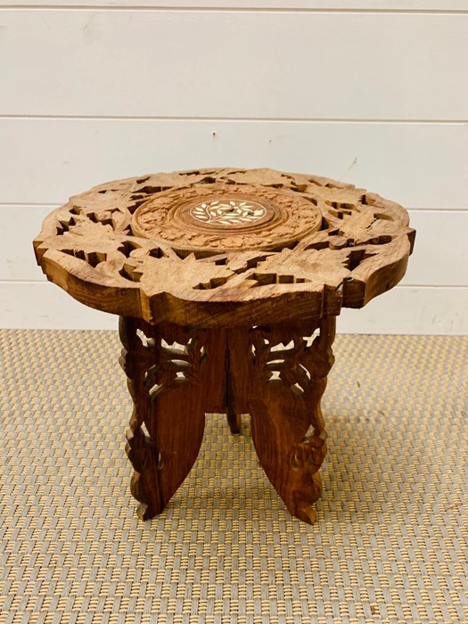 A small stool with leaf design