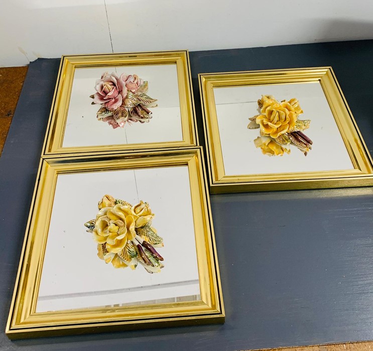 Three square framed mirrors with 3d china roses to center