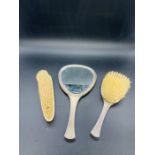 A Selection of three white metal backed dressing table brushes