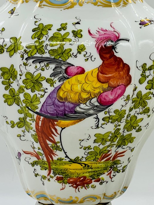 A pair of porcelain vases with lids, painted with exotics birds and scattered springs, stamped - Image 3 of 5