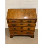 Early Georgian walnut bureau, fall front opening to an interior fitted with pigeon holes, drawers