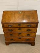 Early Georgian walnut bureau, fall front opening to an interior fitted with pigeon holes, drawers