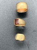 A Selection of 9 ct gold rings to include a wedding band and two signet rings (Total Weight 15.65g)