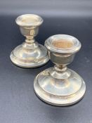 A Pair of Hallmarked Silver squat candlesticks