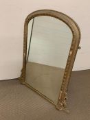 A gilt framed arch shaped mirror (108cm x 72cm)