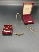 A Selection of 9 ct yellow gold jewellery to include two pairs of earrings and a necklace (Total