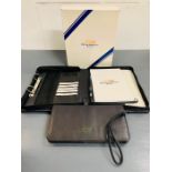 Boxed British American racing F1 promotional organizer folder with paper, calculator and pockets.