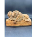 A carved wooden memo of "The Lion of Lucerne"