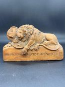 A carved wooden memo of "The Lion of Lucerne"