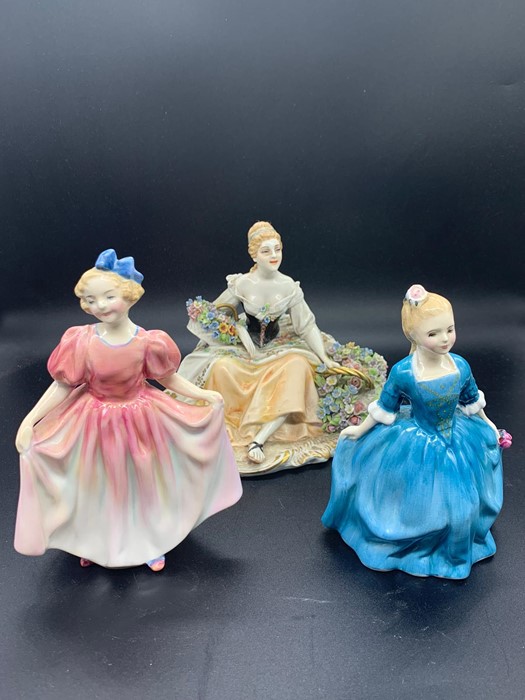 Two Royal Doulton bone china figures "A Child from Williamsburg 1963"," Sweeting 1935" and a