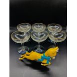 A Set of Six Babycham Glasses along with a Babycham Advertising Figure