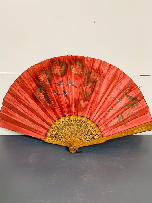 A vintage silk hand fan