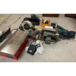 A selection of power tools to include a circular saw, sander, jigsaw etc